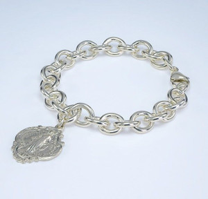 Extra heavy solid sterling silver link style bracelet with hail Mary Miraculous Charm. 7 1/2" Bracelet comes in a deluxe velvet gift box. Made in the USA