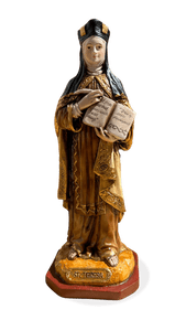 Saint Theresa of Avila Statue by Liscano.  This statue of Saint Theresa of Avila is made in Colombia, South America. The statue of St. Theresa of Avila has been beautifully hand painted by the Widows of Colombian Violence.It's measurements are  8.5"H  x 3" round diameter base.