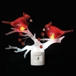 Night light that features a white branch and two red cardinals on the branch. 