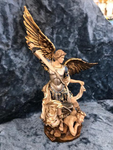 Beautifully detailed St Michael the Archangel Statue by Liscano. This statue of St Michael the Archangel is made in Colombia, South America. The statue of St Michael the Archangel has been beautifully hand painted by the Widows of Colombian Violence. It's measurements are  9"H  x 3" round diameter base.