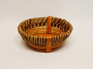 This attractive basket is a large rustic style round basket. The large rustic basket measures 13" dia x 4" deep. The rustic basket has slotted handles for easy handling! 