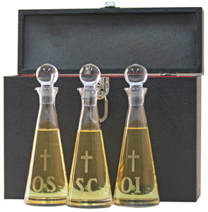 Store Holy Oil safely and securely in this ambry set available from St. Jude Shop.
• Bottles are made of hand-cut, imported crystal for the highest-quality bottles.
• Each bottle is engraved with "OI", "OS", or "SC".
• A bottle engraved with "OC" is also available.
• Bottles are 9 inches tall, have a 2 7/8-inch diameter, and can hold six ounces of liquid.
• Each bottle includes a stopper.
• The pictured case is not included.
• Order in sets of three.
Purchase this and all of your church supplies at St. Jude Shop.