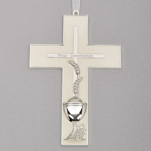 7"H White Holy Communion Wall Cross. The white communion wall cross has a cross within the cross and wheat, grapes and the chalice are depicted at the bottom of the cross. The words First Communion are also written on the cross. Made of zinc alloy-lead free