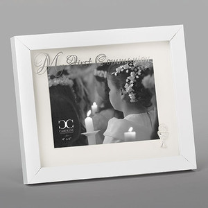 8"H White Holy Communion Photo Frame. The white holy  communion photo frame has the words "My First Communion " written across the top of the Glass. The picture frame holds a 5" x 7' photo.  Made of glass and plastic. 