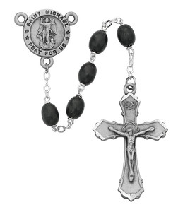 Black 6x8mm Oval Beads Rosary with silver oxidized Crucifix and St Michael Center. Rosary presents in a deluxe gift box.  Made in the USA.
