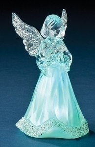 The LED Angel Statue Figurine when lit up in green.