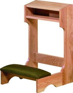 Square wooden structure with a soft pad for kneeling and an armrest with a shelf at the top.