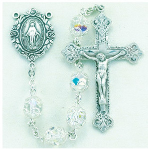 8mm Double Capped Crystal Swarovski Beads. All Sterling Silver Findings with Sterling Silver Filigree Caps, Sterling Silver Flower Miraculous Center and Fancy Baroque with 2-1/8" Sterling Crucifix. Deluxe Velour Gift Box Included. Made in the USA of solid sterling pins, chain, beads, centers, and crucifixes. 