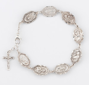 18x10mm Sterling Silver Rosary Bracelet with Patron Saint Medals St. Therese, St. Jude, St. Joseph, St. Anthony, St. Christopher, St. Anne, Miraculous Medal, Sacred Heart and Sterling Silver Crucifix. Comes in a deluxe velour gift box. Made in the USA. 
