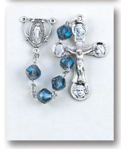 8MM Metalllic Sapphire tin cut crystal beads. rosary is made of Rhodium plated brass wires and chains with a sterling silver Miraculous Medal and 2" Crucifix.  This tin cut sapphire bead rosary comes in a deluxe velvet box. Rosary is made in the USA.