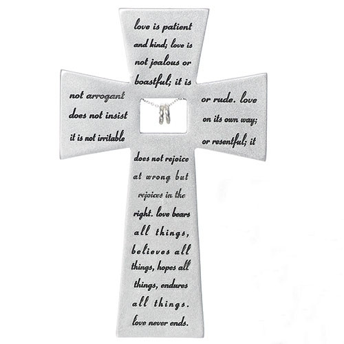 Love Never Fails Wall Cross is made of a resin stone mix. The Love Never Fails Wall Cross measurements are  7"H x 4.5"W x 0.5"D.  The words on the cross are from Corinthians; Love is Patient and Kind,  Love is not jealous.....Makes a wonderful wedding gift!
