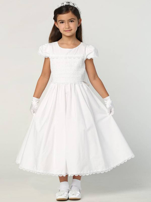 Smocked Cotton Communion Dress. This adorable smocked cotton communion dress has a cotton skirt and is tea length. Made in the USA