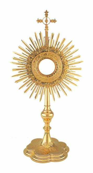  Golden monstrance with sun rays and a cross on top