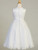 Product Description: 
This First Communion dress features detailed embroidery along the bodice with flower appliques along the neckline flowing into a tulle skirt with a lace hem. Shop this style online at St. Jude’s Shop! 

Embroidered Tulle Bodice 
Flower Applique Neckline
Rhinestone and Flower Decor at Waistline
Tulle Skirt With Embroidered Edges 
String Bow
First Communion is a momentous occasion. Your daughter or granddaughter will feel extra special in this beautifully intricate embroidered design, with floral lace appliques and Rhinestone waistline. This style ties back to create a small bow on the backside to not take away from the tulle skirt's lace hem. 
Tea Length 
Accessories Sold Separately
Made in the U.S.A. 
3 Dress Limit Per Order
