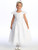 Little girl smiling in a white Communion dress with embroidered tulle.