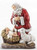 Slim Line Kneeling Santa Resin Figurine ~ Combining the two major symbols of Christmas - the Christ Child and Santa Claus - in a way that connotes their proper relationship - the secular subservient to the sacred - is an idea that goes back many years with Ray Gauer. While raising his own large family he became increasingly concerned about the over-commercialization of the holiday. To depict Santa Claus - St. Nicholas - on his knees before the newborn Christ Child, seemed a most effective means to counteract that trend.  The idea - which he humbly considers inspired - reached fruition in the beautiful figurine of the KNEELING SANTA which he commissioned the internationally renowned sculptor, Rudolph Vargas, to create in 1976. It has evolved into an extensive line of related products that have won a place of honor in Christian homes, schools and churches.