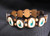 St Jude ~ These bracelets are made in Nicaragua and come with either brown or gold beads. Pictures may also vary. 