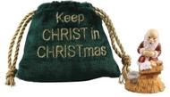 Kneeling Santa in a Velvet Bag.  Kneeling Santa comes in a velvet bag that says "Keep the Christ in Christmas. Made of a resin/stone mix.