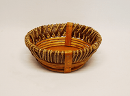 This attractive basket is a large rustic style round basket. The large rustic basket measures 13" dia x 4" deep. The rustic basket has slotted handles for easy handling! 