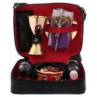 Leather case with mass kit and red lining. Leather case with red lining contains:  oil stock, holy water sprinkler, bottle for wine and water, chalice, paten, ciboria, candles, candle holders, stole, mass linens, and cross. Hard leather case measures:  7 1/2" x 5 1/2" x 3 1/2"