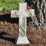 Cardinal Memorial Cross. The memorial cross stands 16"H. The Cardinal Cross is made of a resin stone mix. On the memorial cross is written: "When a cardinal appears an angel is near." On the cross is depicted a cardinal sitting on branches with green leaves. 