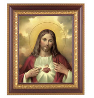 11" x 13" Sacred Heart of Jesus Framed Artwork. Frame is a detailed cherry wood with a gold edging. 
