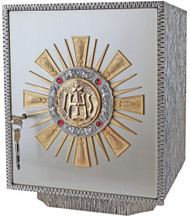 Exposition Tabernacle Style 657 is an Oxidized silver with gold rays. 24k bright gold plated inside. Four ruby stones. Dimensions: 15-1⁄4˝H. x 12˝W. x 12-1⁄4˝D. Door opening: 12-1⁄2˝H. x 10-3⁄4˝W. Wt. 57 lbs. Silver plated as shown.

 