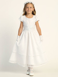 This communion dress is a short sleeved corded embroidered tulle dress with sequins. Scalloped waist line. Tea-length dress has an illusion neckline.  Accessories are sold separately. 
Made in the USA. 3 Dress Limit per order!