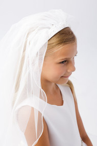 Girl smiling with a white veil.