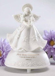 5" First Holy Communion Musical Angel is made of porcelain. Message says "First Holy Communion - I am the bread of life...". Tune plays the Lord's Prayer. Measurements: 5" height x 3.5" diameter. Gift Boxed.