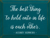 Wood Sign: The best thing to hold onto in life is each other. - Audrey Hepburn