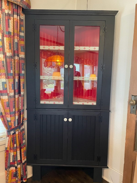 Custom 3-toned Corner Hutch shown in Solid Black w/ Solid Ivory Shevles & custom Solid Red back panels & spine
