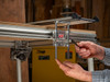 The lever is offset from the guide rail rather than hidden underneath it. It can also be reversed.