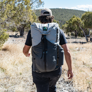 Hiker traverses rocky desert trail, Silverton's 2-way hip belt cinched for a secure fit