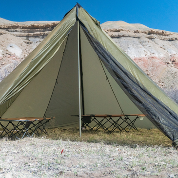 12 person tent with full height zipper doors open showing two sleeping cots set up and sturdy aluminum center pole