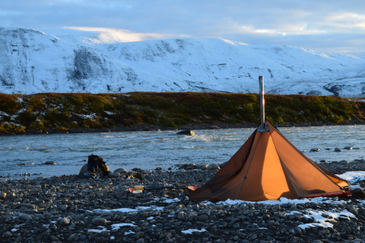 Hunting camp with Cimarron shelter, optional carbon pole installed, stove jack with rain flap visible for wood stove use