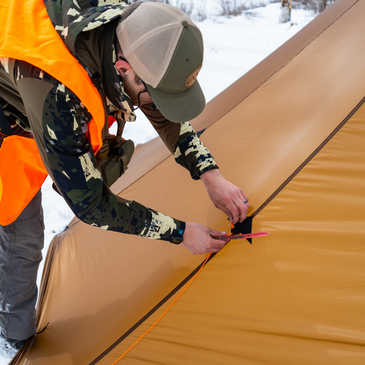 Close-up of Redcliff tent's external guyout loops with fluorescent orange line tensioned to mid-panel point