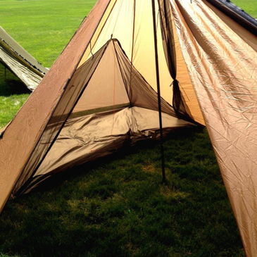 Cimarron tent with Half Nest set up on one half, leaving the other half open for gear, stove, and muddy boots