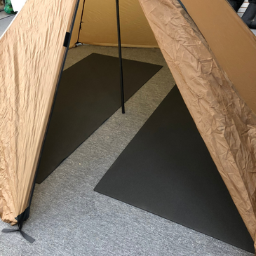 two 40" x 81" Matty ground mats inside a shelter