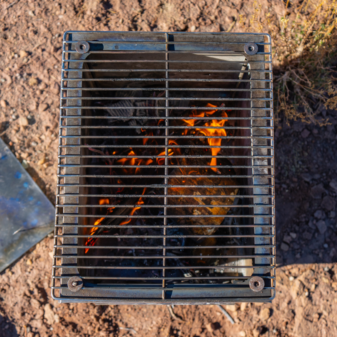 Seek Outside removable grill top for tent stove, providing a stable cooking surface.