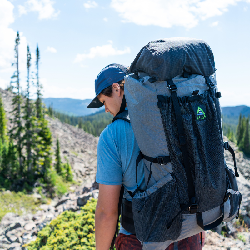 Seek Outside Flight 3 Top Lid accessory adding extra weather-resistant storage capacity to the backpack.