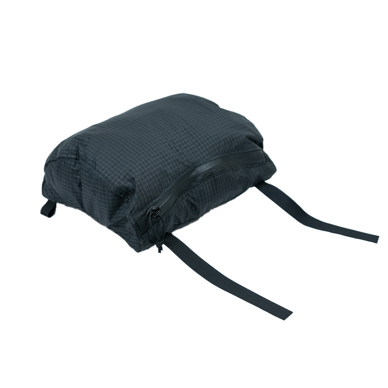 black backpack top lid on a white background