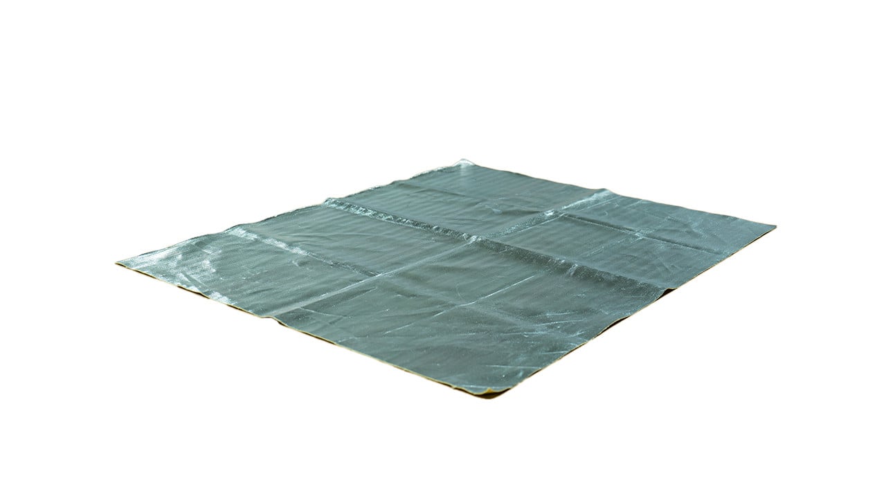 a silver fire mat laying flat on a white background
