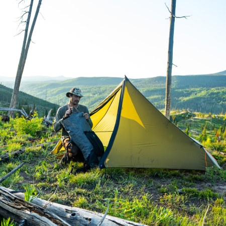 Man sitting In Brightwater tent