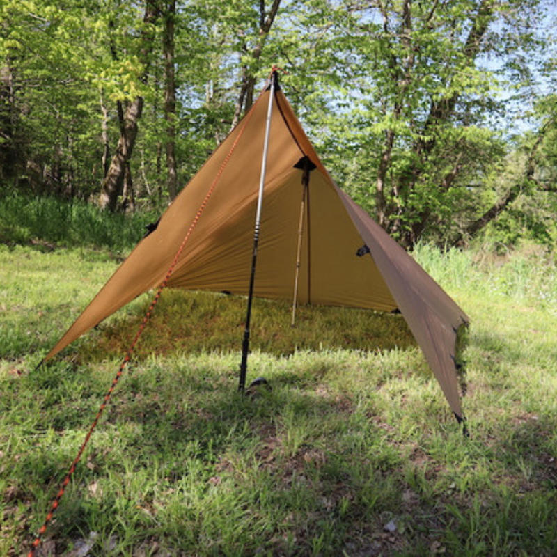 Seek Outside DST Tarp A-frame pitch with one end raised or folded back, showing reinforced cone and perimeter tieouts

