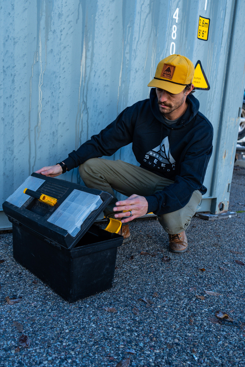 Man Wearing Black Hoodie and Yellow Hat