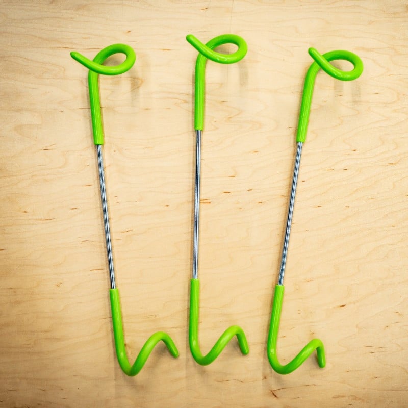 silver pole hooks with green rubber ends