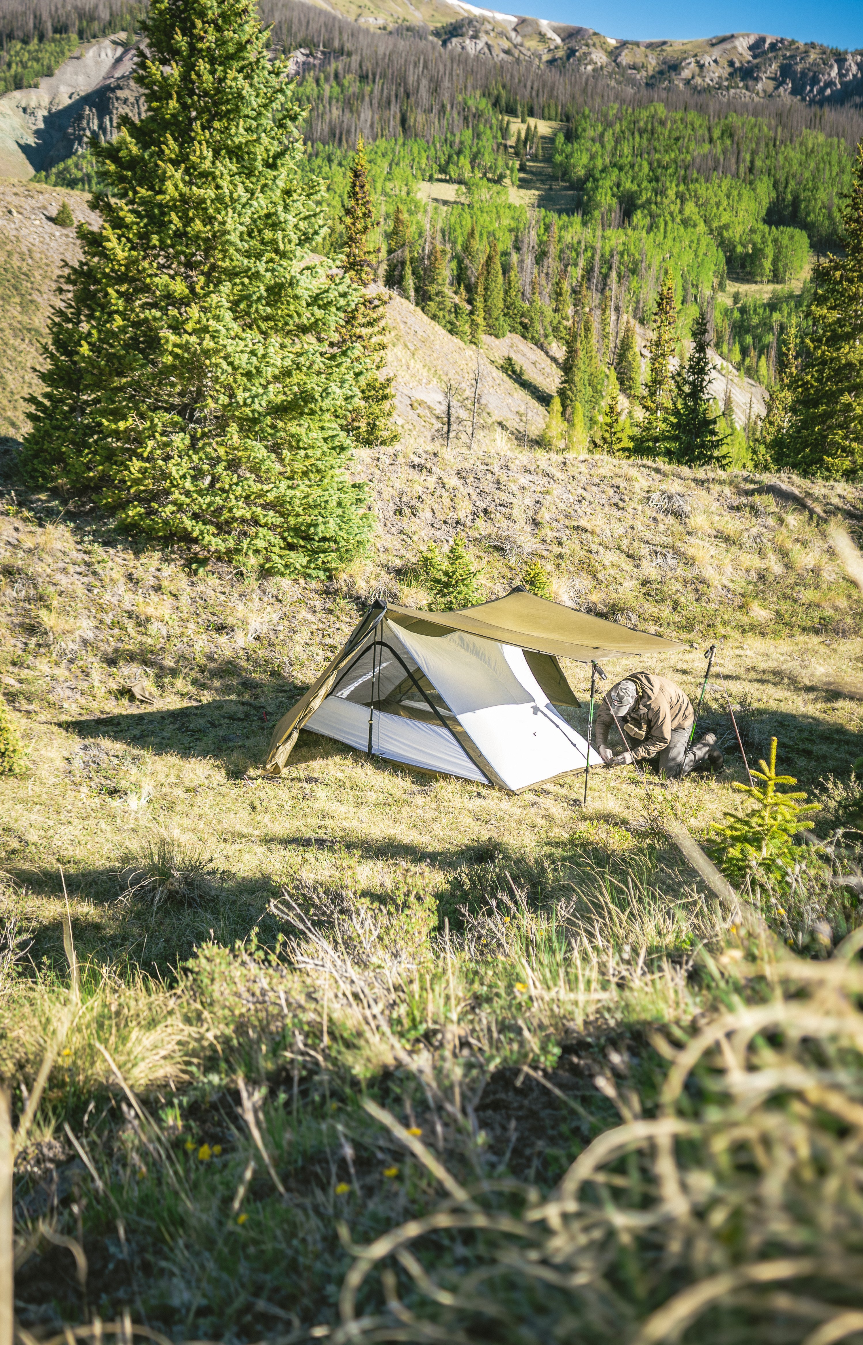 Guardian Nest set up inside tent, nest door closed, tent doors open, showing 67.4 square foot interior and 51.5-inch peak height