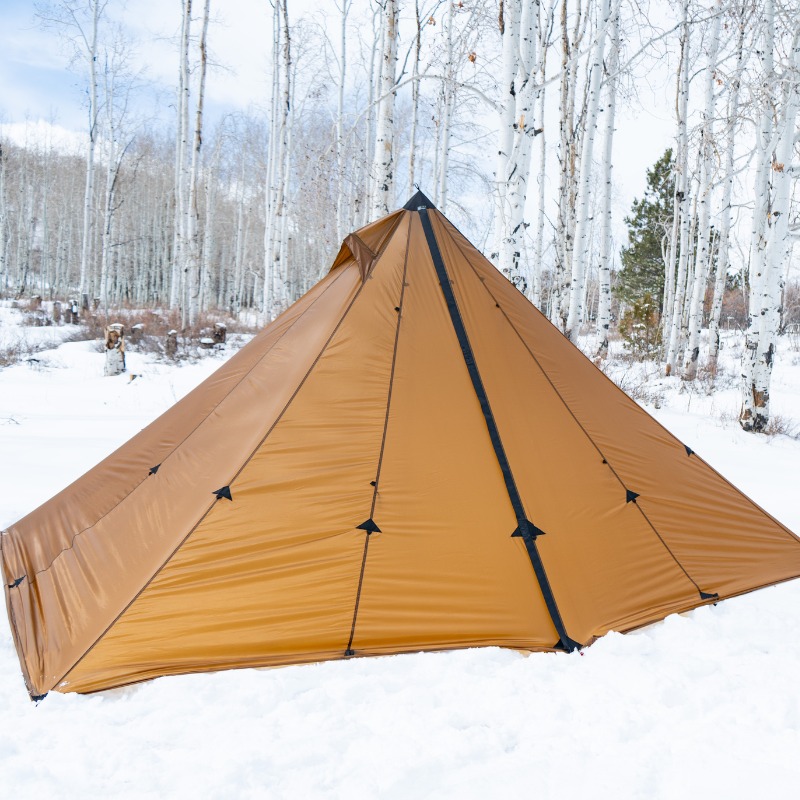 redcliff tent pitched with the sod skirt buried in the snow 