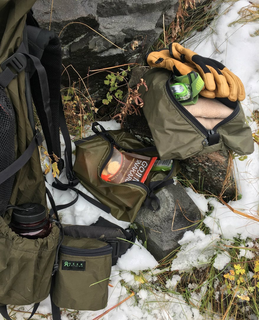 flat pouch filled with gear, as part of an organization system